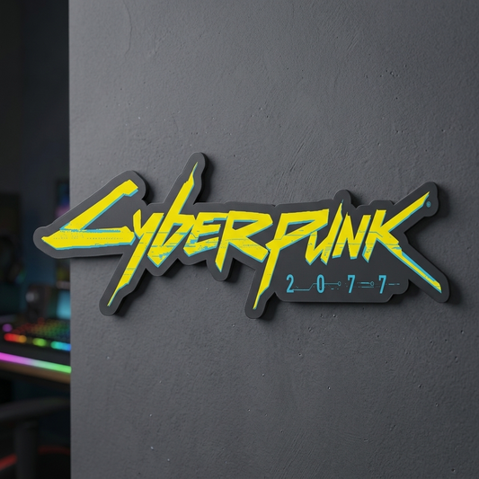 Cyberpunk 2077 logo on a dark surface with blurred gaming setup in the background