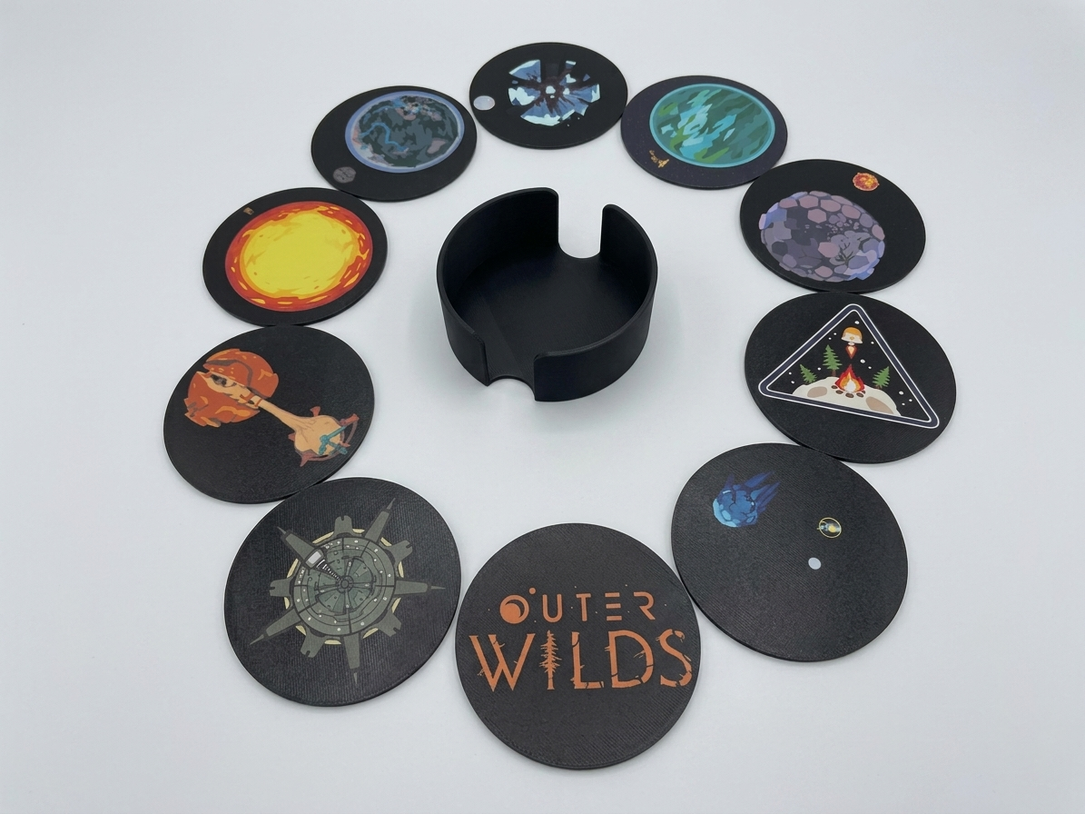 Collection of 'Outer Wilds' themed coasters arranged around a central black holder on a light gray background.