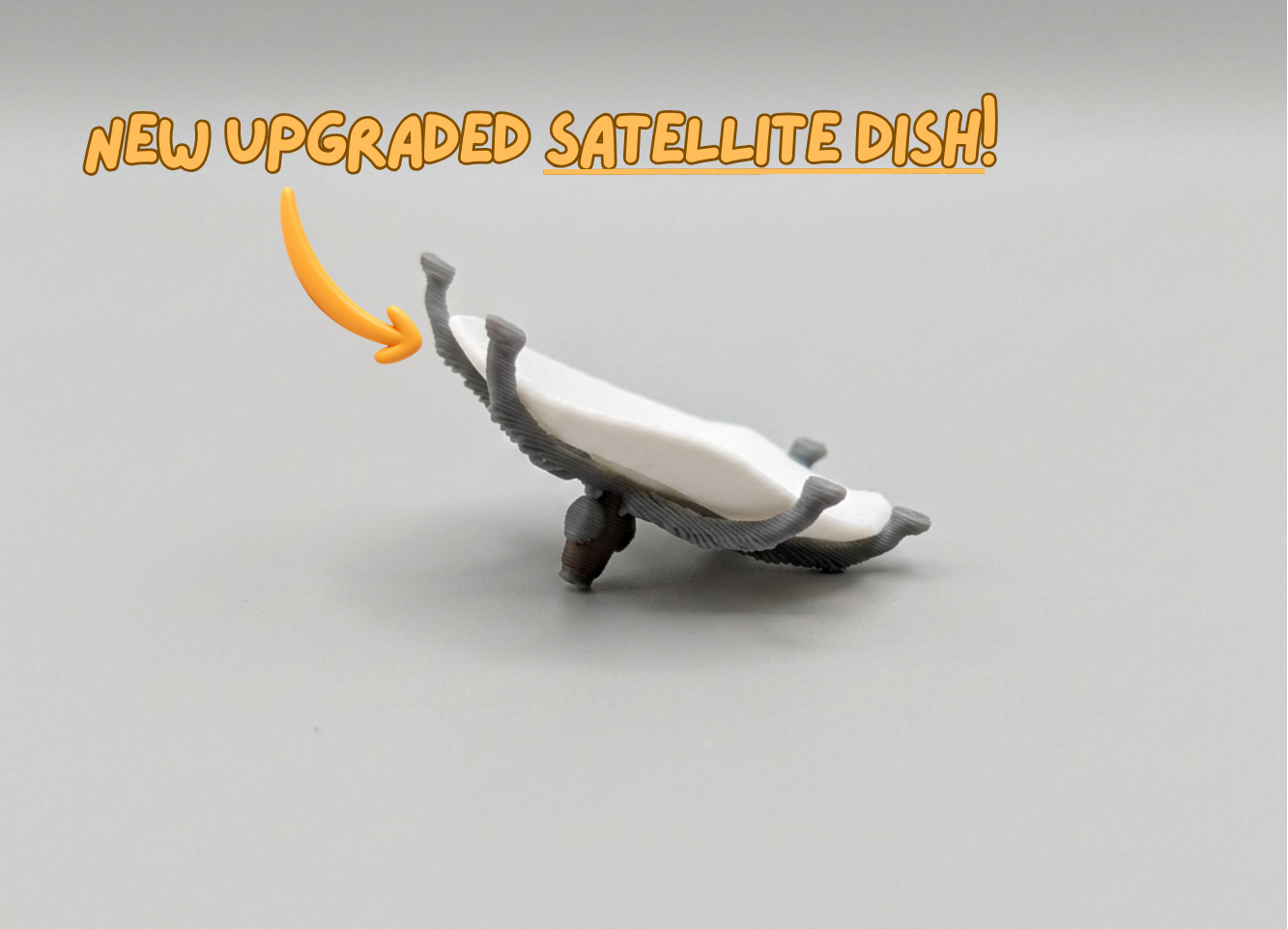 Toy satellite dish on a gray background with text 'NEW UPGRADED SATELLITE DISH!'.