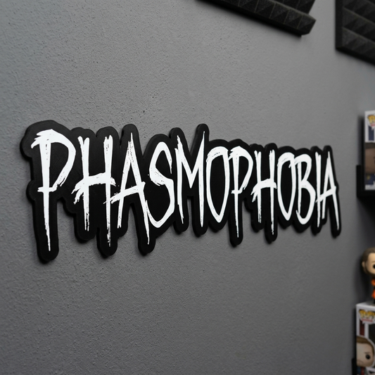 Sticker with 'PHASMOPHOBIA' text on a gray wall