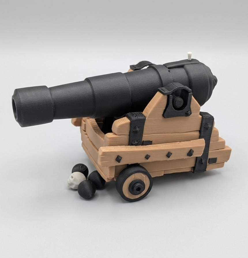 Toy cannon on wheels with wooden carriage and black barrel on a white background