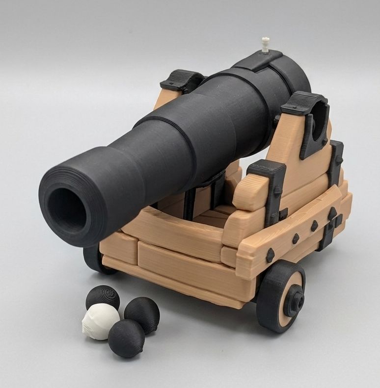 Model of a cannon with a beige carriage and black barrel on a gray background