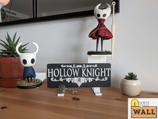 Hollow knight logo sign with figurines