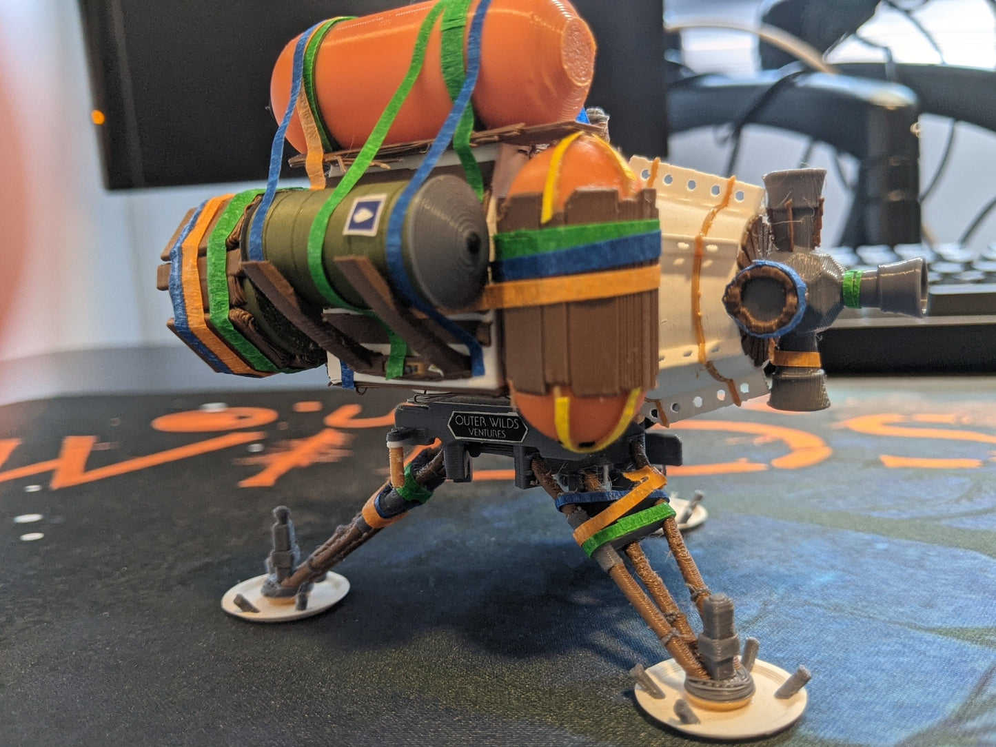 Outer wilds ship miniature on desk rear