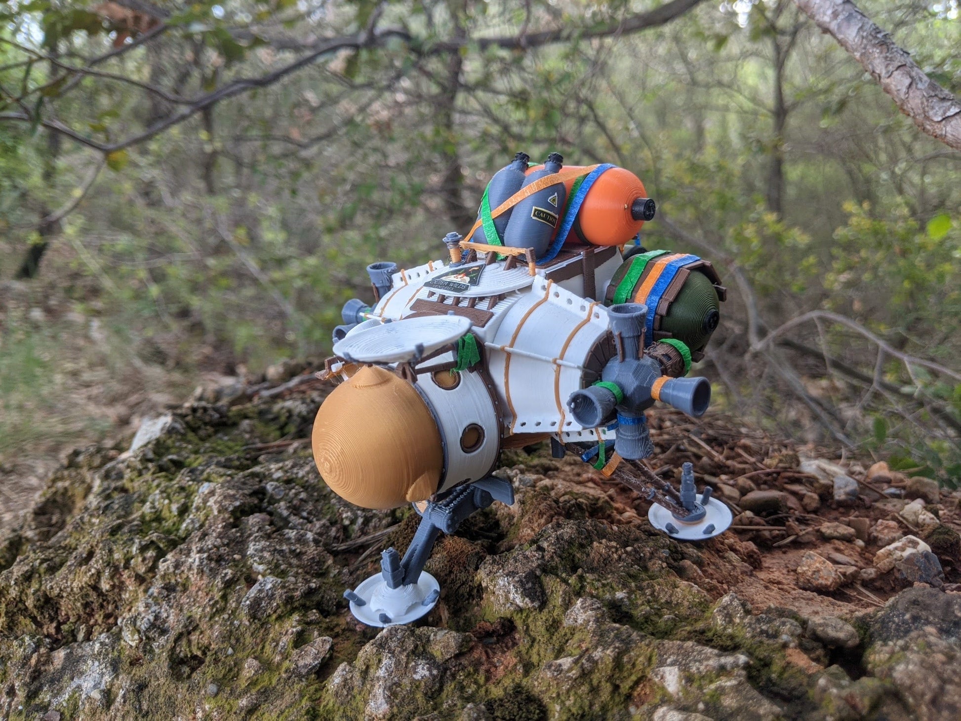 Outer wilds ship miniature on a rock